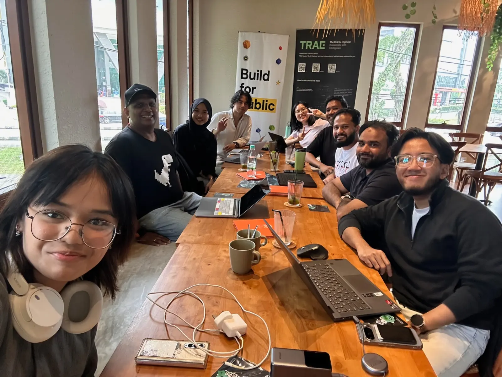 Group selfie down the length of the table at the end of the day